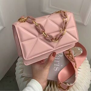 Women bag light pink color with a fashion chain on it. Brand new.